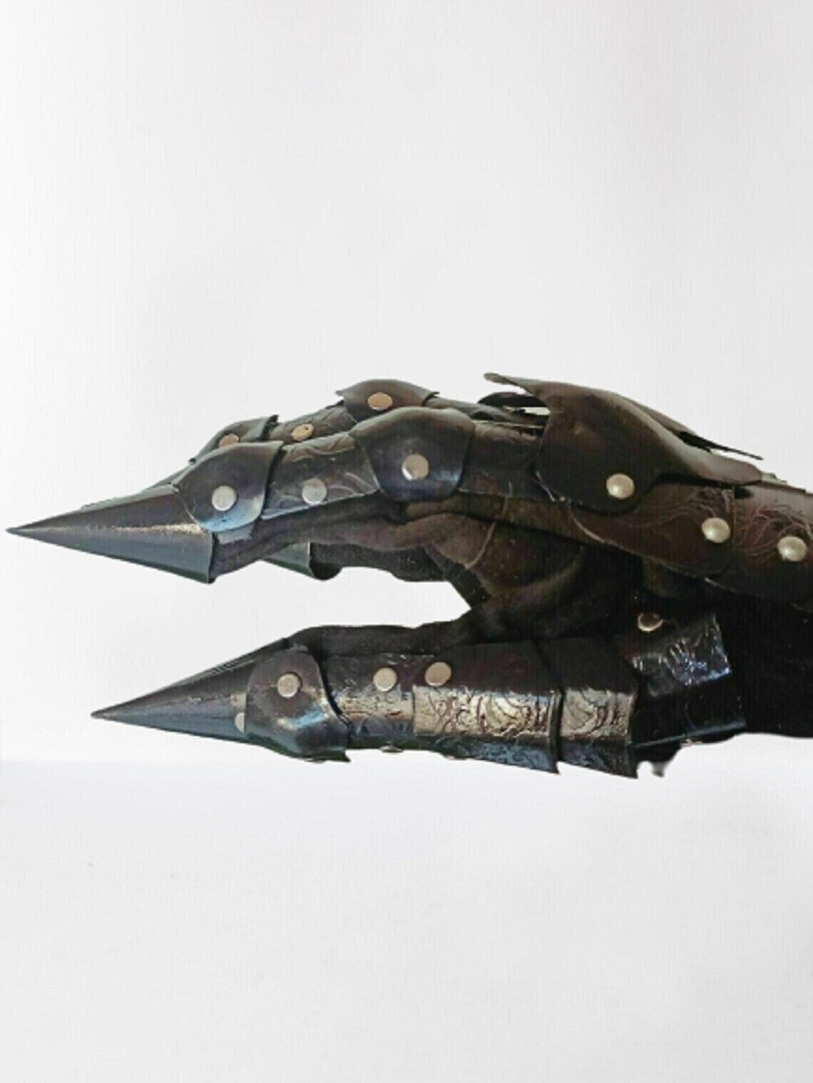 Medieval black metal gauntlets with gothic flair, perfect for crusader style