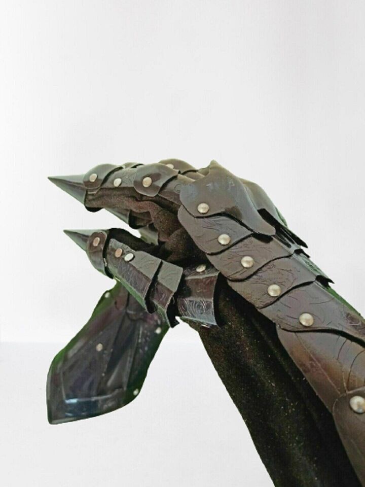 Medieval black metal gauntlets with gothic flair, perfect for crusader style
